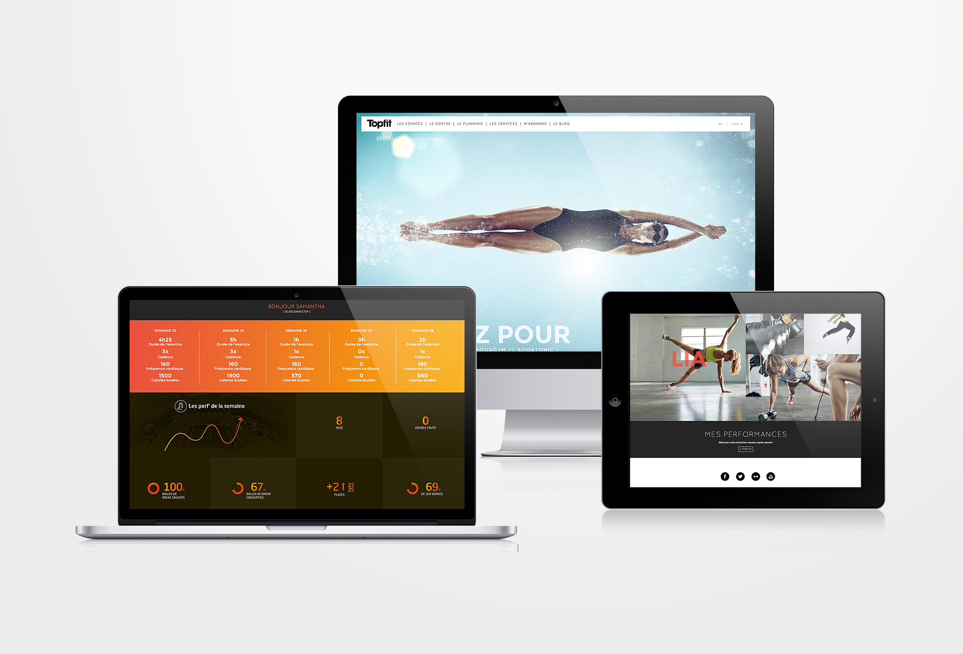 Trois appareils présentent une création site internet : un iMac avec un nageur sous l'eau, un ordinateur portable présentant des statistiques et des graphiques de fitness, et une tablette révélant une scène de gymnastique avec une barre d'haltères et deux personnes s'entraînant.