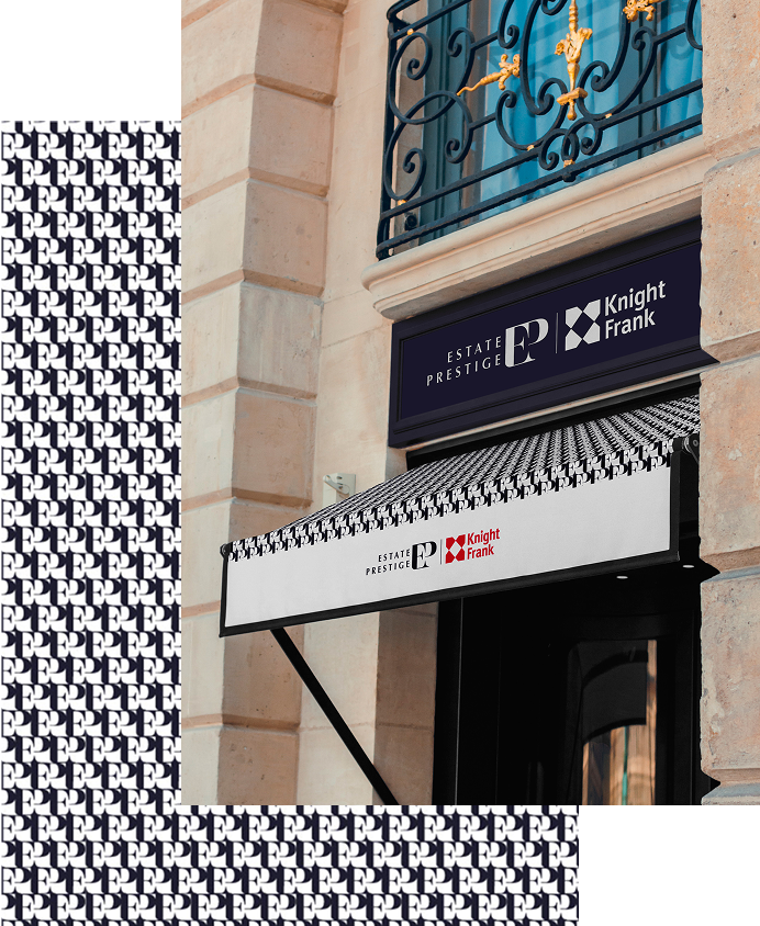 Une entrée de bâtiment avec un auvent rayé comportant les logos "Estate Prestige" et "Knight Frank", reflétant l'attention portée aux détails dans le cadre du développement de site web sur mesure. Des initiales répétées ornent le bord et le fond de l'auvent.